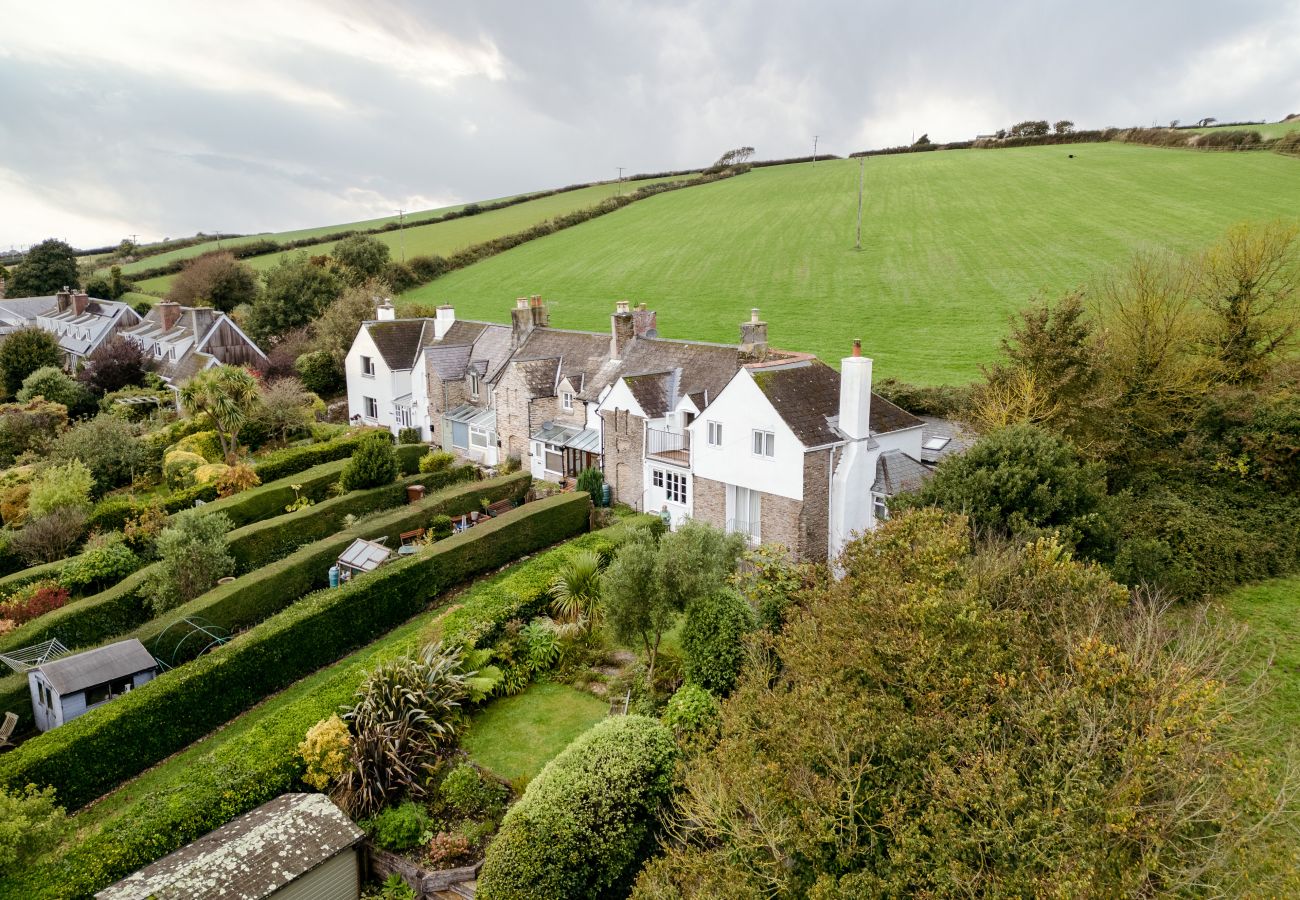 harming stone-built holiday cottage in South Milton with a private garden and countryside views.